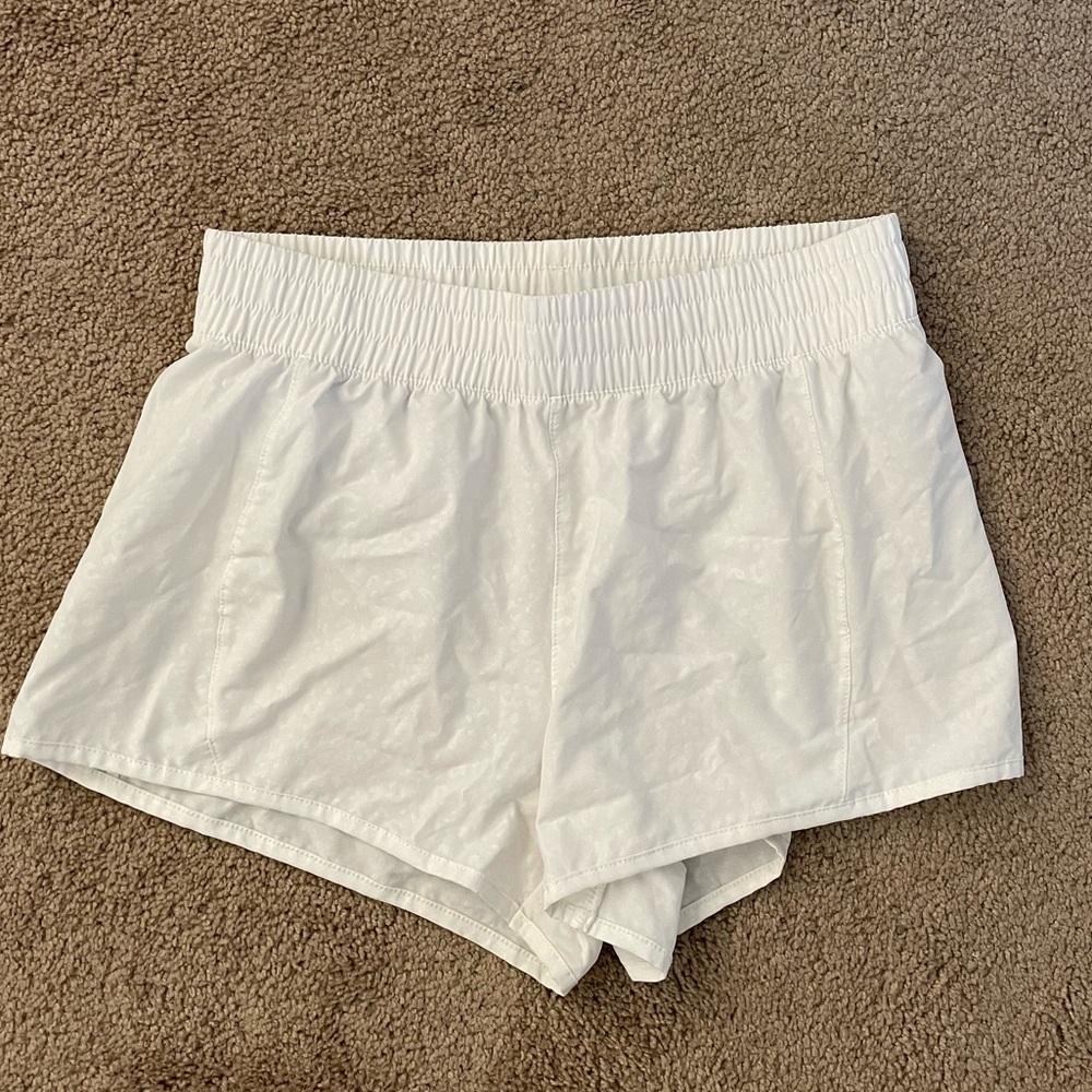 White leopard print running shorts